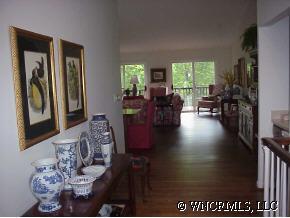 39 Hunting Country Road Tryon, NC 28782 - Photo 6 of 8 a view of a dining room with furniture window and wooden floor