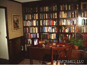39 Hunting Country Road Tryon, NC 28782 - Photo 7 of 8 a view of a workspace room with floor to book shelf