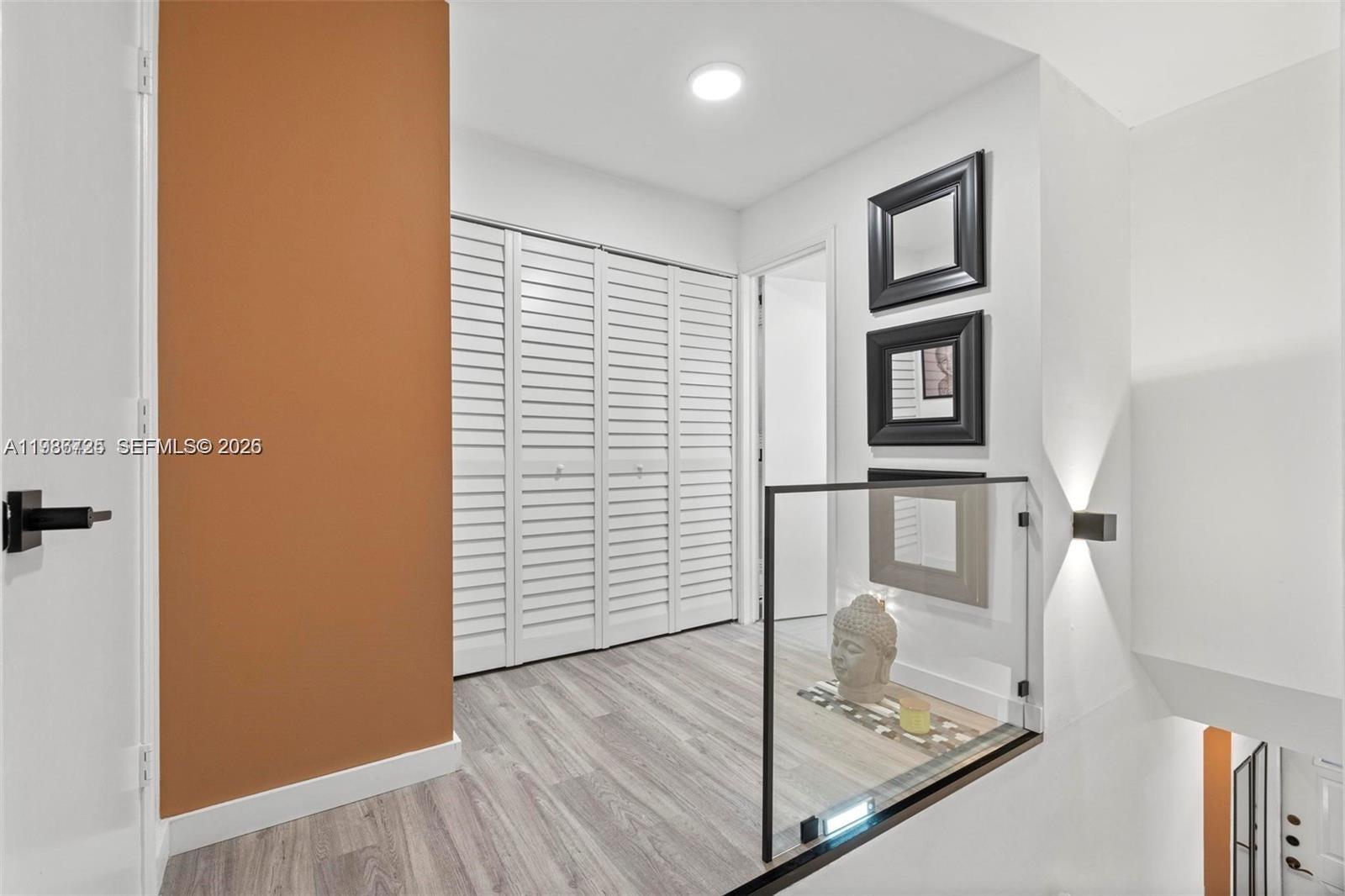 149 Northwest 70th Street, Unit 101C Boca Raton, FL 33487 - Photo 11 of 21 a bathroom with a sink and a mirror