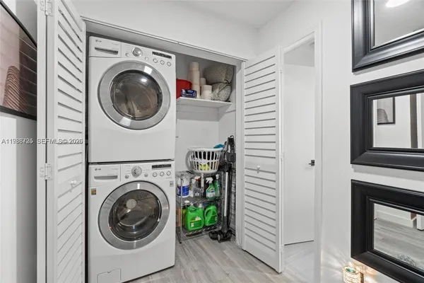 a view of a hallway with washer and dryer