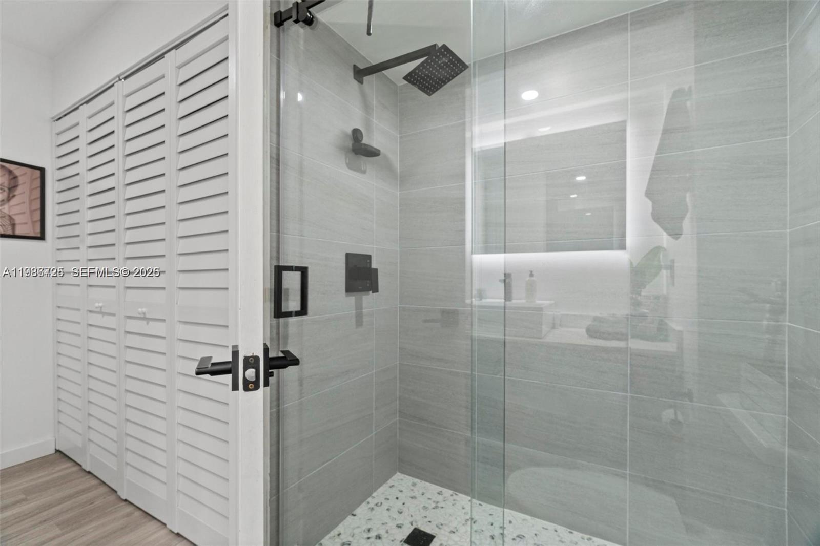 149 Northwest 70th Street, Unit 101C Boca Raton, FL 33487 - Photo 17 of 21 a bathroom with a shower