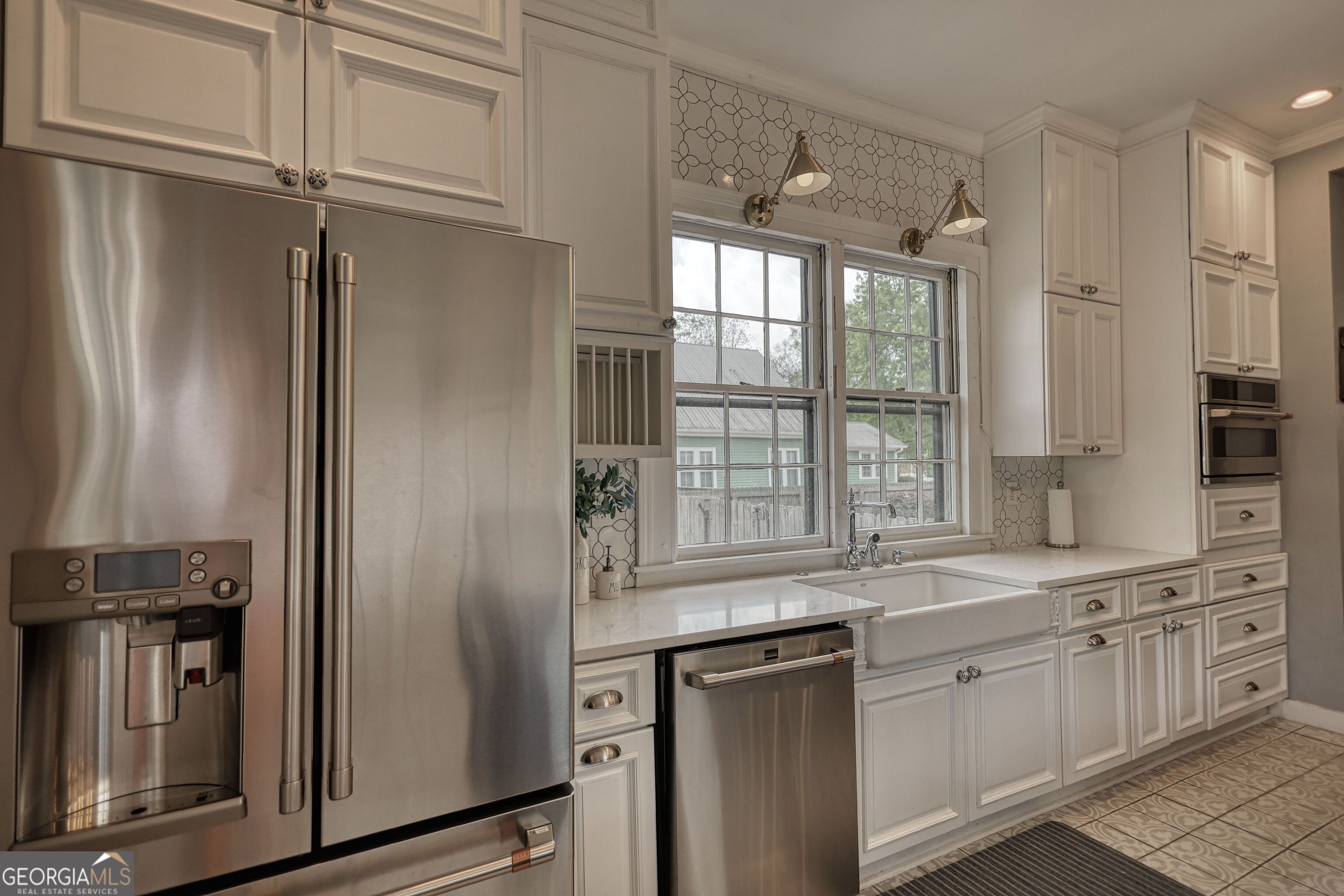172 North 2nd Street Madison, GA 30650 - Photo 26 of 69 a kitchen with stainless steel appliances granite countertop a refrigerator and a sink