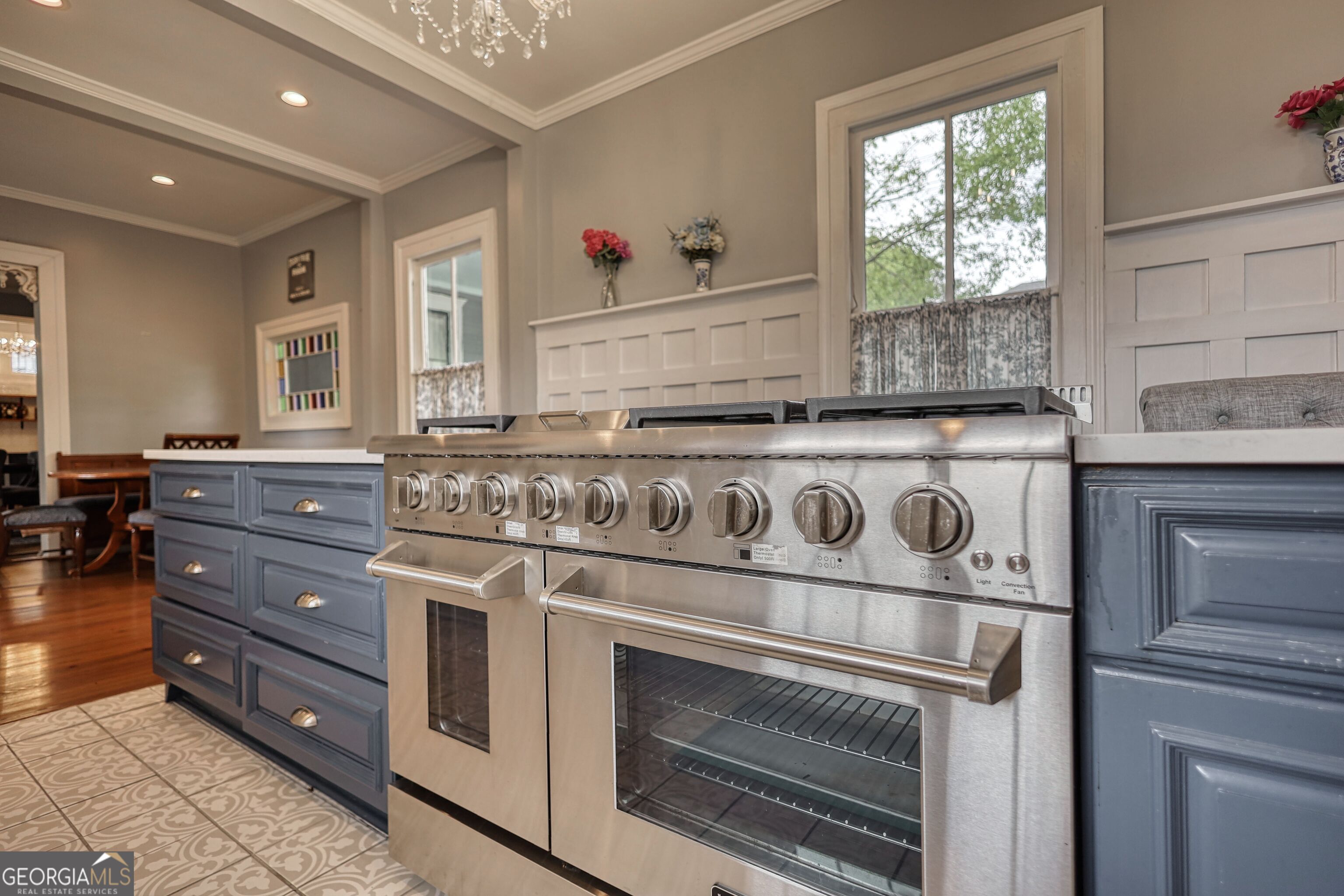 172 North 2nd Street Madison, GA 30650 - Photo 28 of 69 a kitchen with granite countertop a stove and a sink