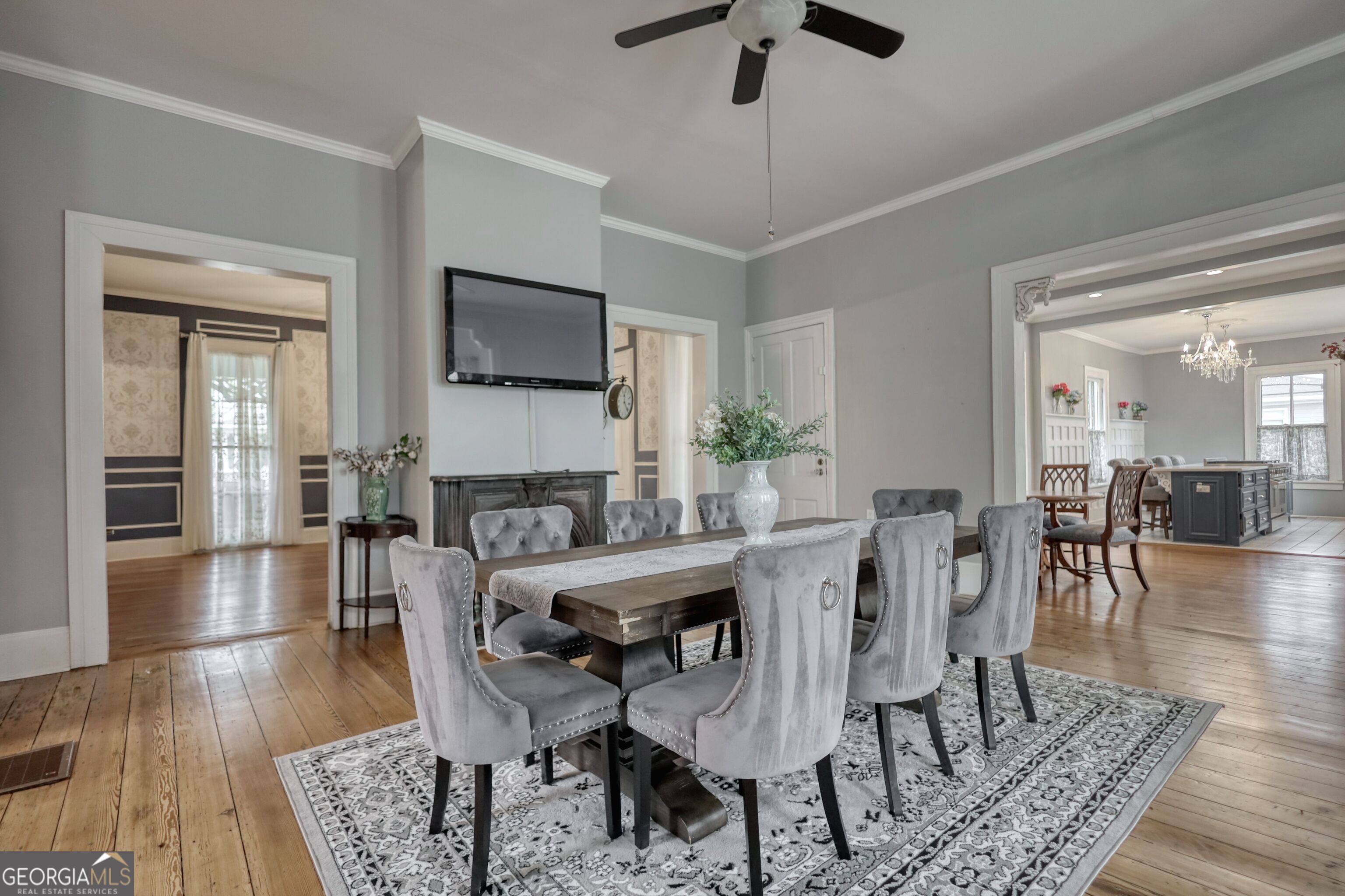 172 North 2nd Street Madison, GA 30650 - Photo 33 of 69 a view of a dining room with furniture wooden floor and chandelier