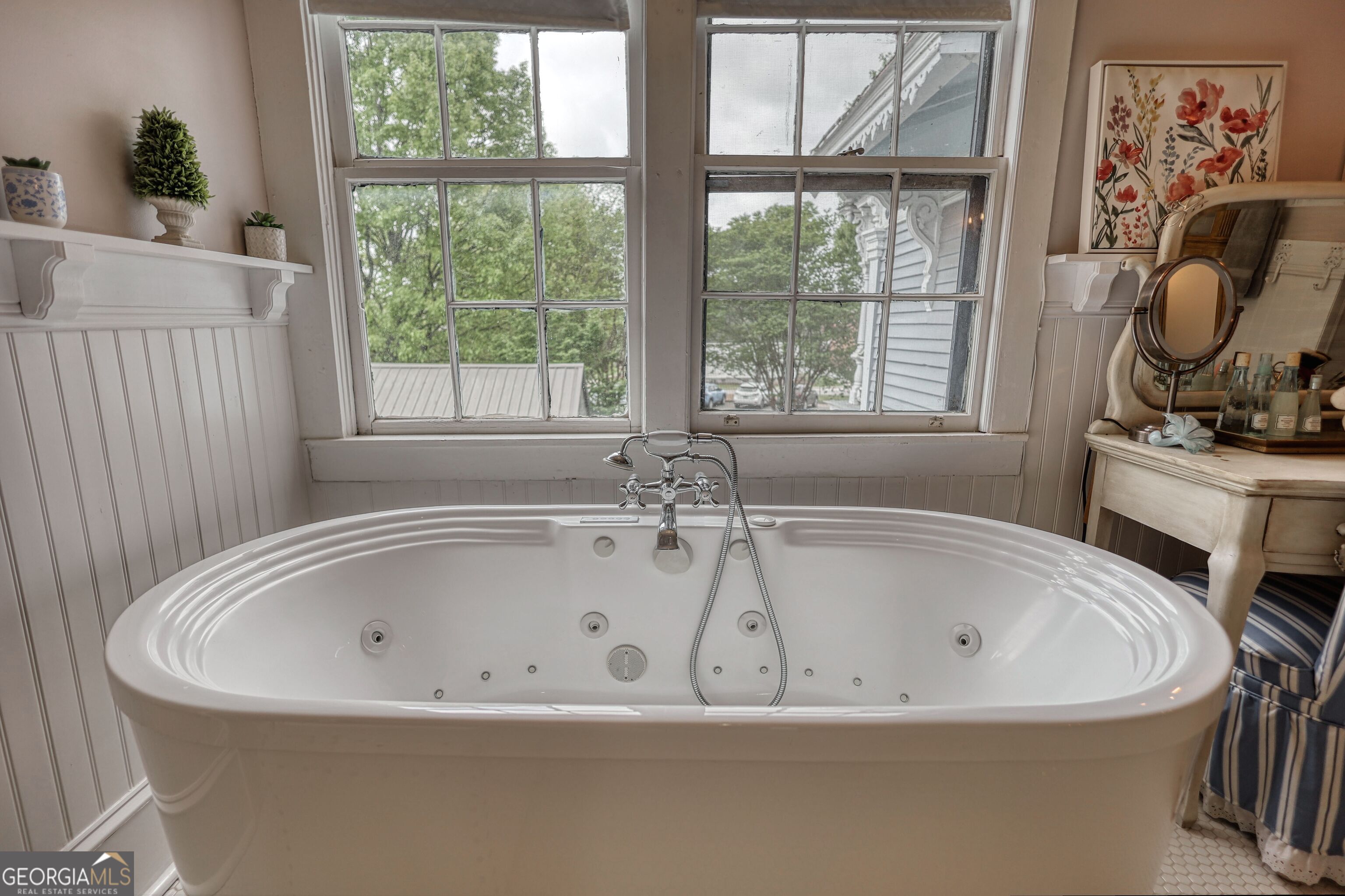 172 North 2nd Street Madison, GA 30650 - Photo 43 of 69 a white bath tub sitting next to a window