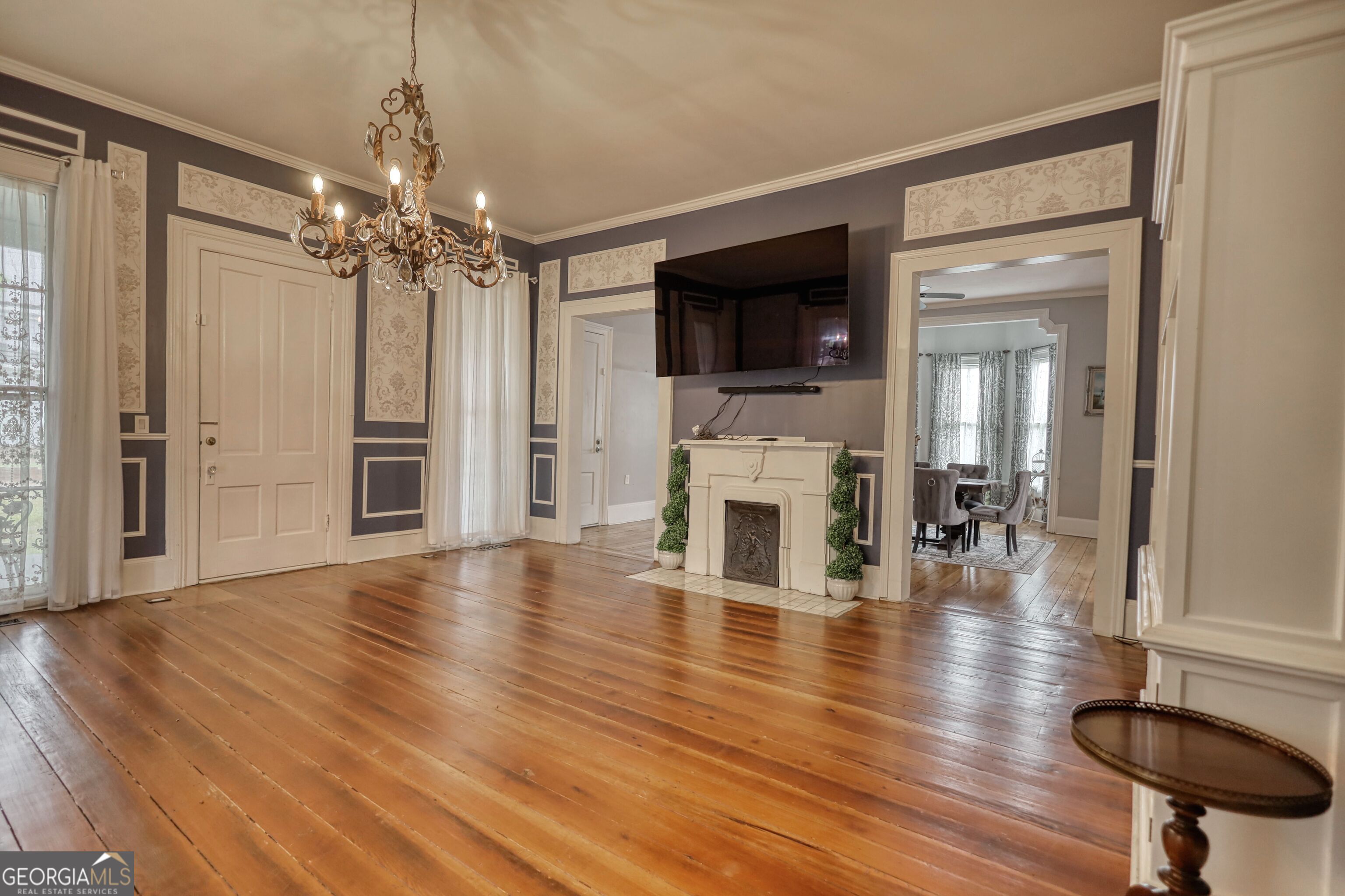 172 North 2nd Street Madison, GA 30650 - Photo 66 of 69 a view of empty room with wooden floor and fireplace