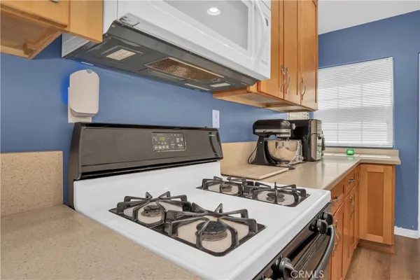 a table with chairs and a stove top oven