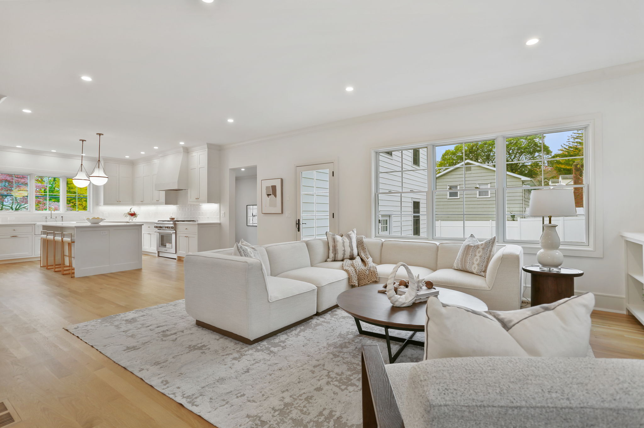 15 Barton Road Fairfield, CT 06824 - Photo 15 of 39 a living room with furniture and a large window