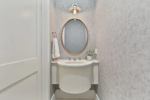 a bathroom with a sink and a mirror