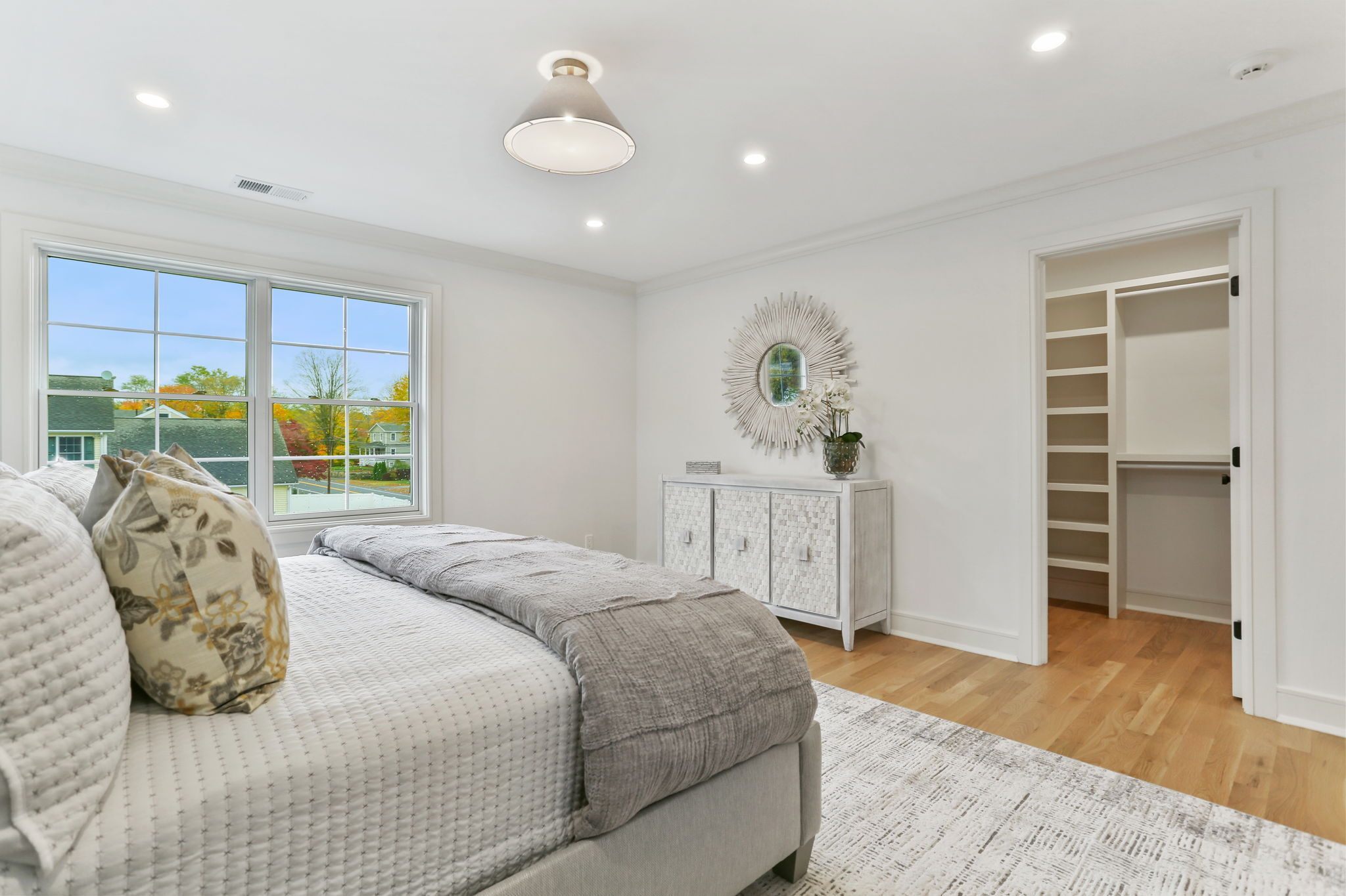 15 Barton Road Fairfield, CT 06824 - Photo 20 of 39 a bedroom with a bed and a window