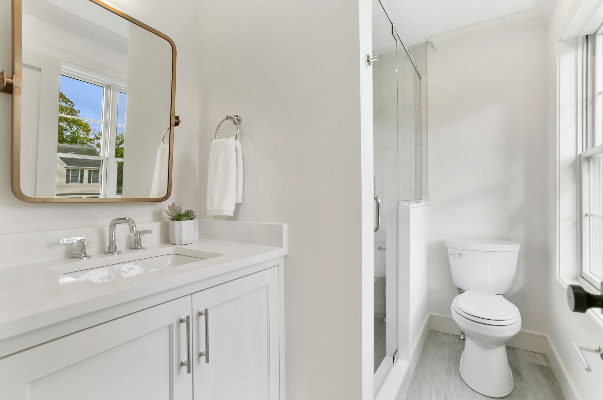 15 Barton Road Fairfield, CT 06824 - Photo 26 of 39 a bathroom with a toilet sink and mirror