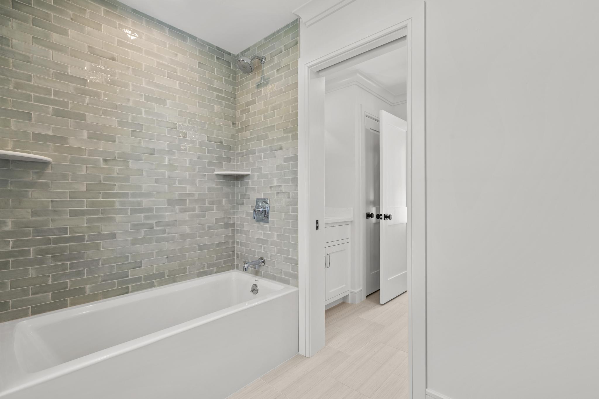 15 Barton Road Fairfield, CT 06824 - Photo 28 of 39 a bathroom with a bathtub and a shower