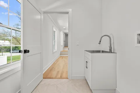 a picture of a room that has a mirror in it