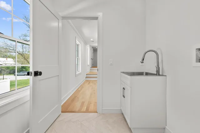 a picture of a room that has a mirror in it