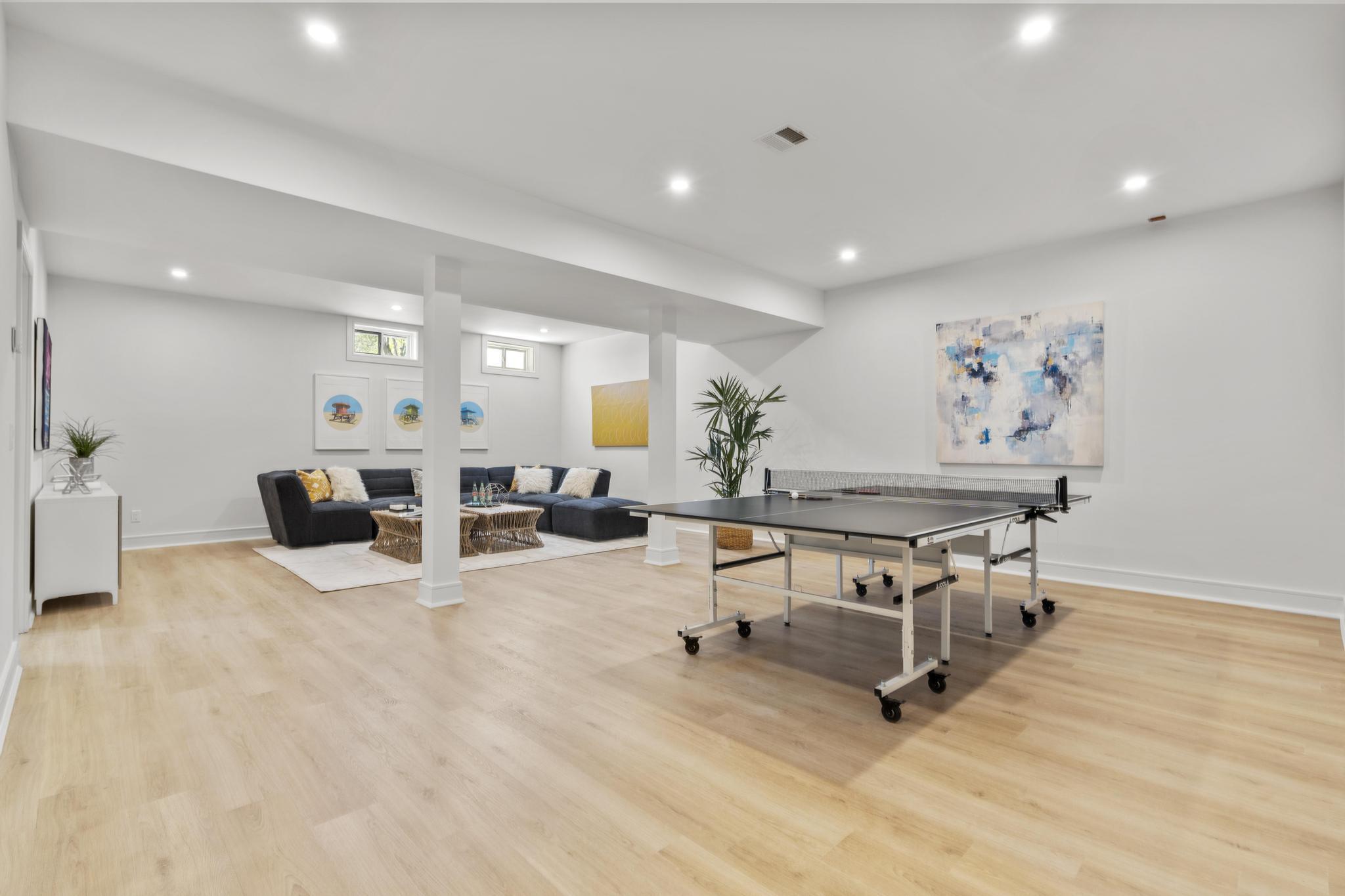 15 Barton Road Fairfield, CT 06824 - Photo 31 of 39 a living room with furniture and a table