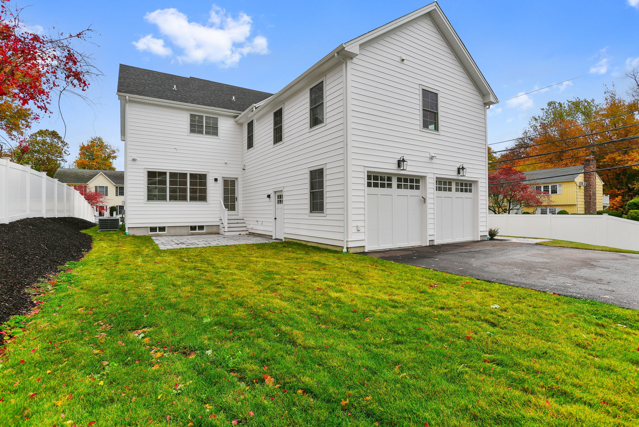 15 Barton Road Fairfield, CT 06824 - Photo 35 of 39 a view of a white house with a yard