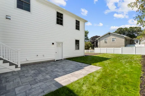 a view of a backyard of the house