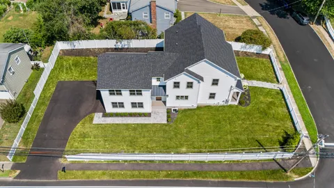 an aerial view of a house with swimming pool
