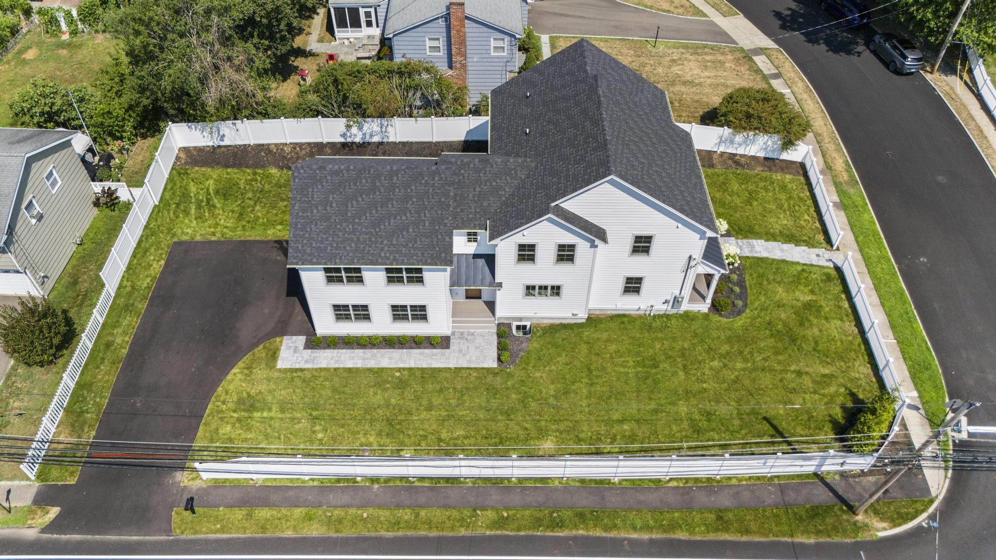 15 Barton Road Fairfield, CT 06824 - Photo 37 of 39 an aerial view of a house with swimming pool