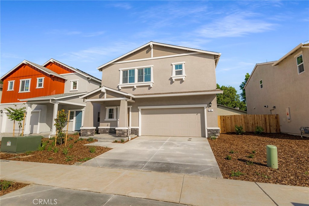 881 Bertino Place Chico, CA 95973 - Photo 3 of 55 a front view of a house with a yard