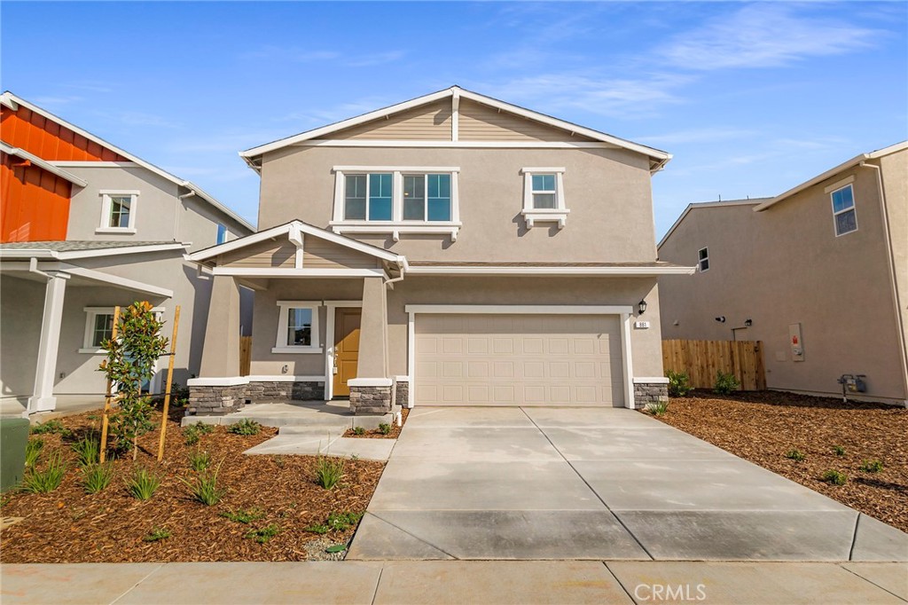 881 Bertino Place Chico, CA 95973 - Photo 4 of 55 a front view of a house with garden
