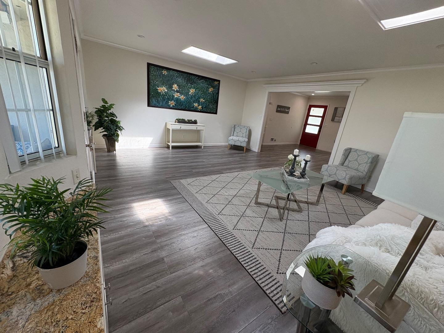 5187 Doyle Road San Jose, CA 95129 - Photo 12 of 39 a living room with furniture and a flat screen tv