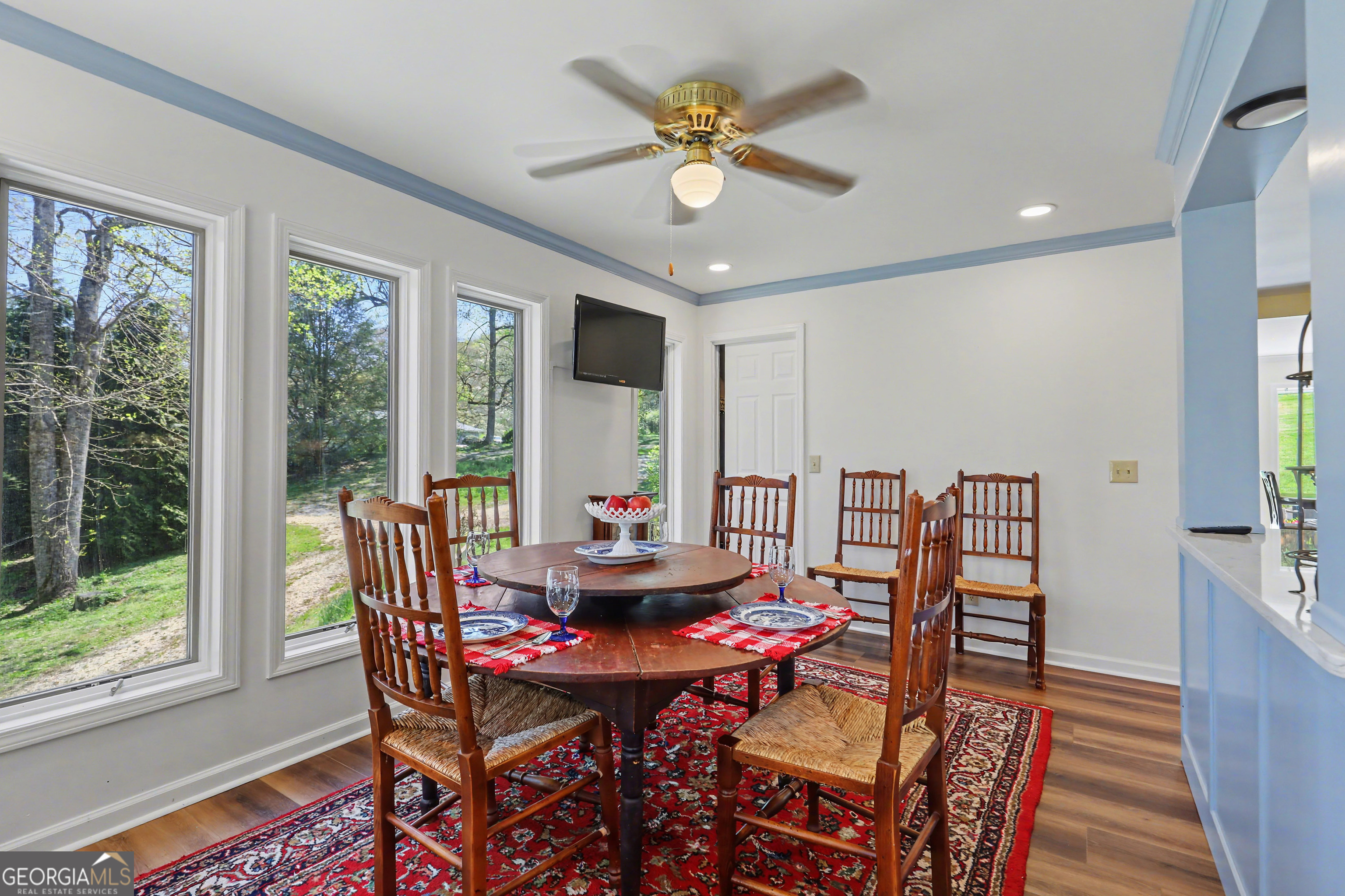 1067-o V Ov Justus Road Rabun Gap, GA 30568 - Photo 22 of 73 a view of a dining room with furniture window and wooden floor