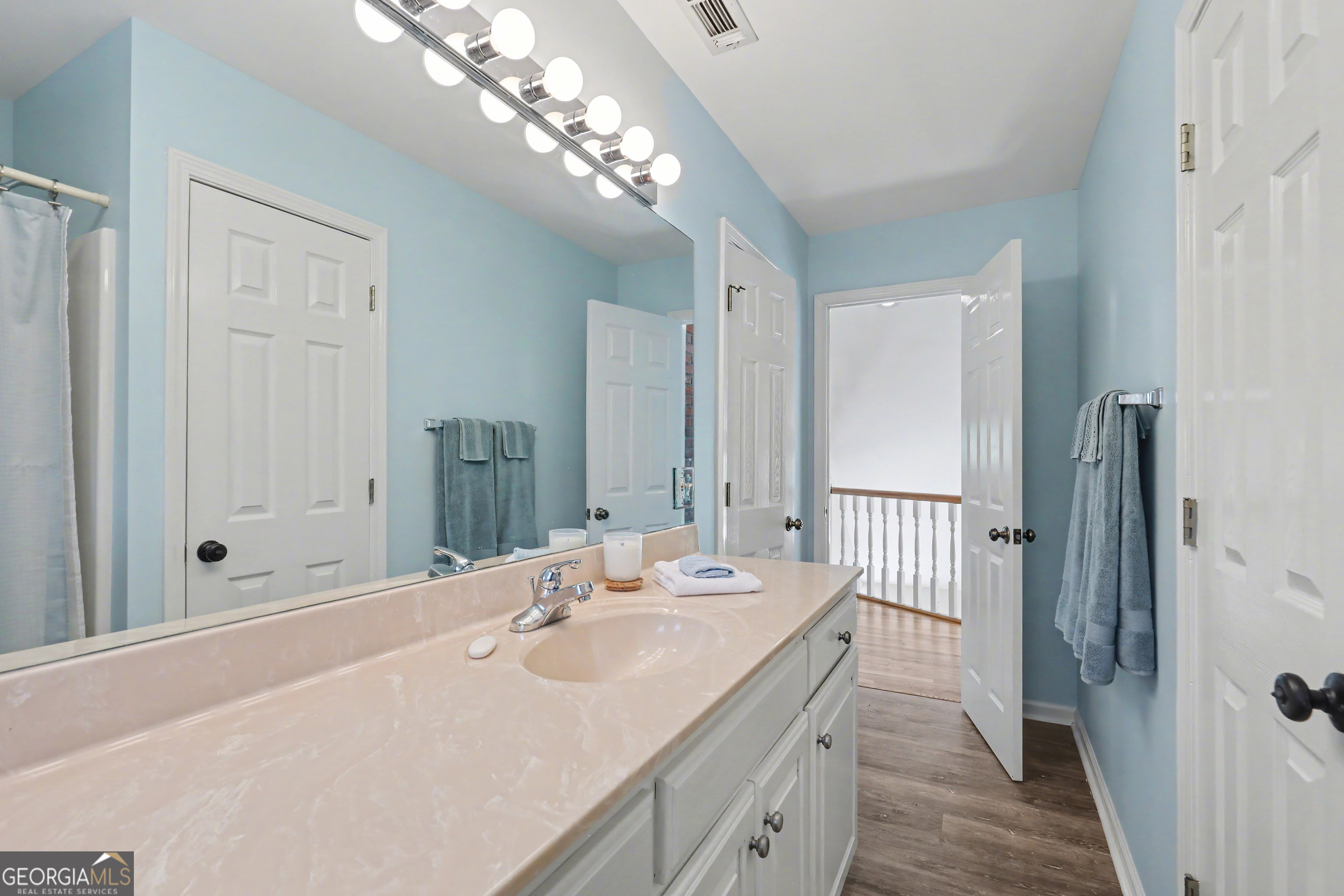 1067-o V Ov Justus Road Rabun Gap, GA 30568 - Photo 44 of 73 a spacious bathroom with a double vanity sink and a mirror
