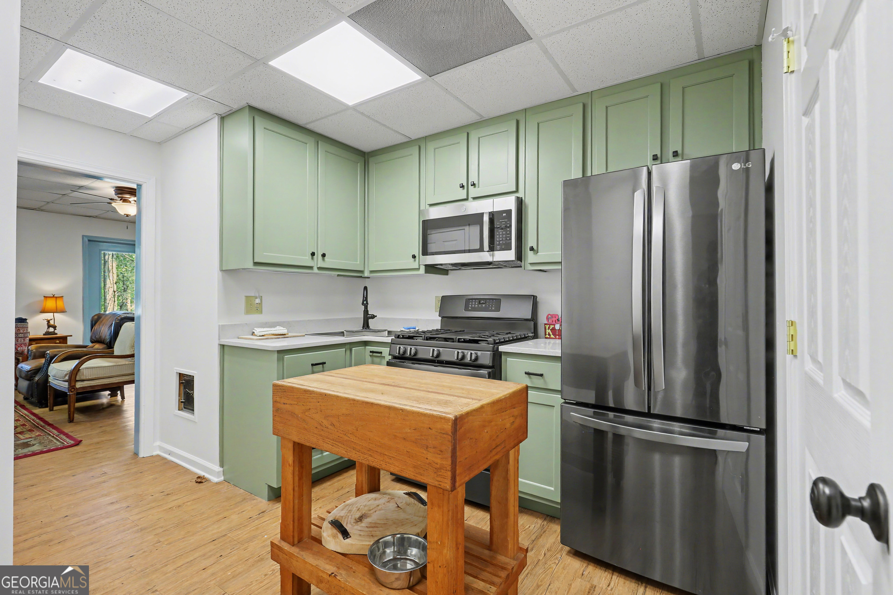 1067-o V Ov Justus Road Rabun Gap, GA 30568 - Photo 46 of 73 a kitchen with stainless steel appliances a refrigerator a stove a sink and a refrigerator