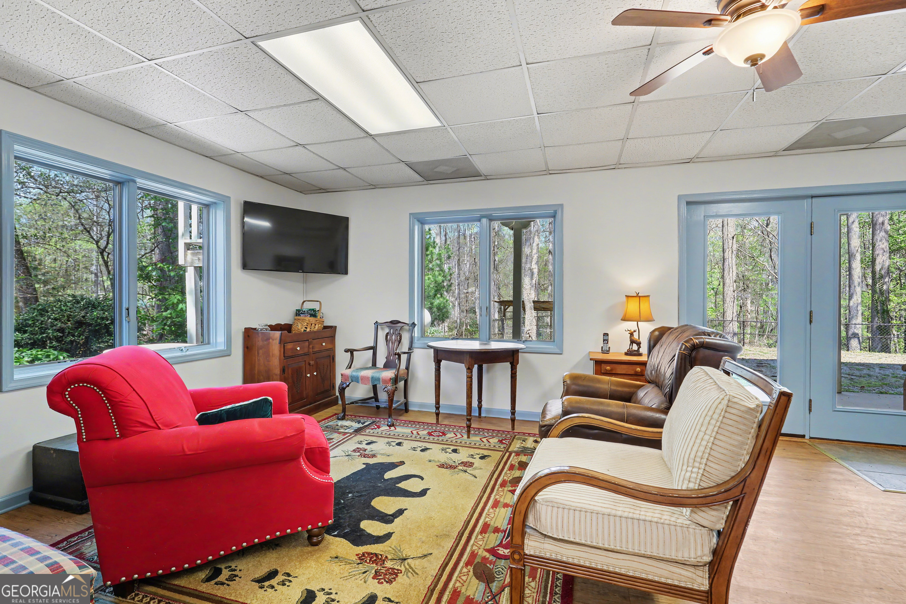 1067-o V Ov Justus Road Rabun Gap, GA 30568 - Photo 47 of 73 a living room with furniture a flat screen tv and a large window