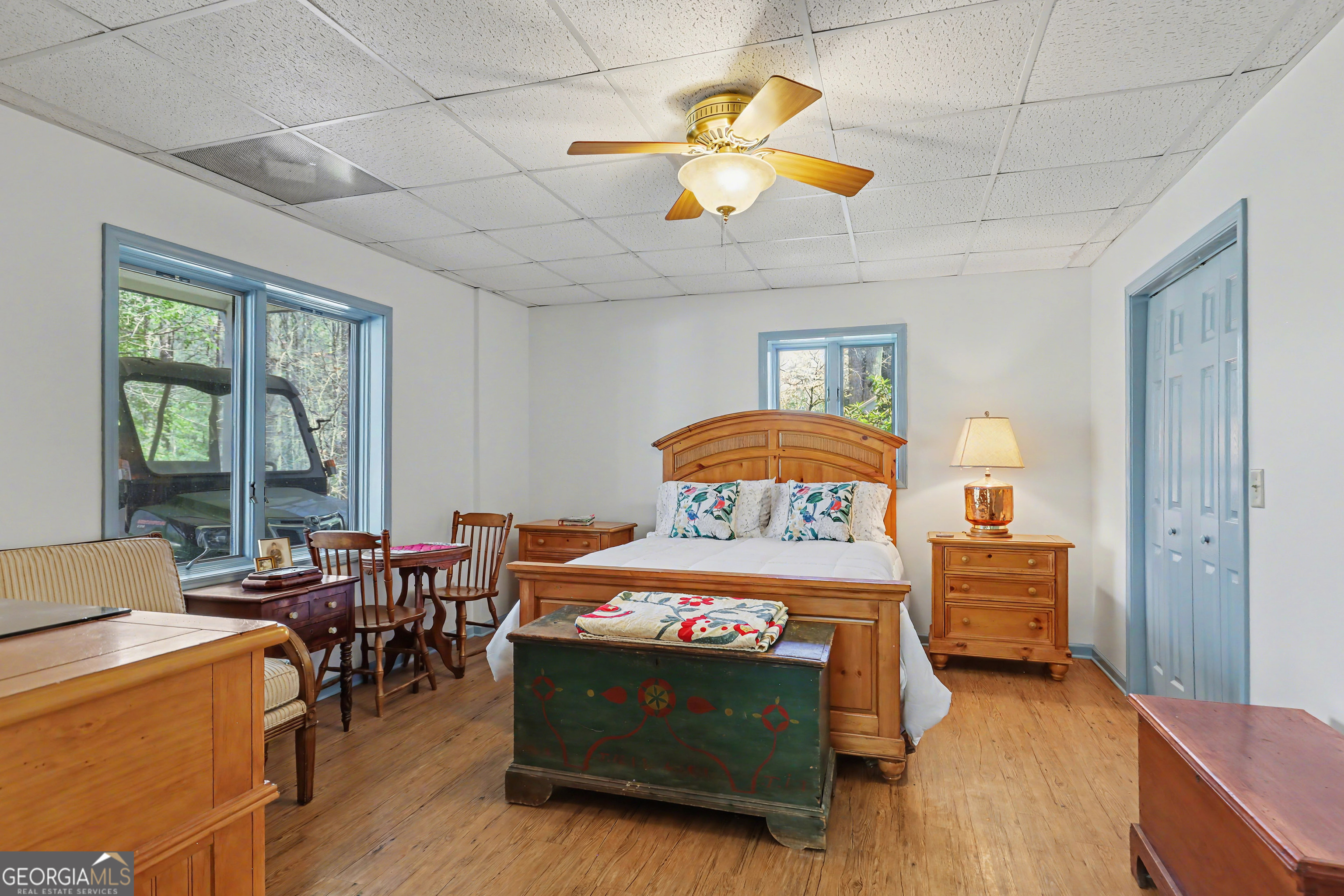 1067-o V Ov Justus Road Rabun Gap, GA 30568 - Photo 53 of 73 a bedroom with a bed and a chandelier