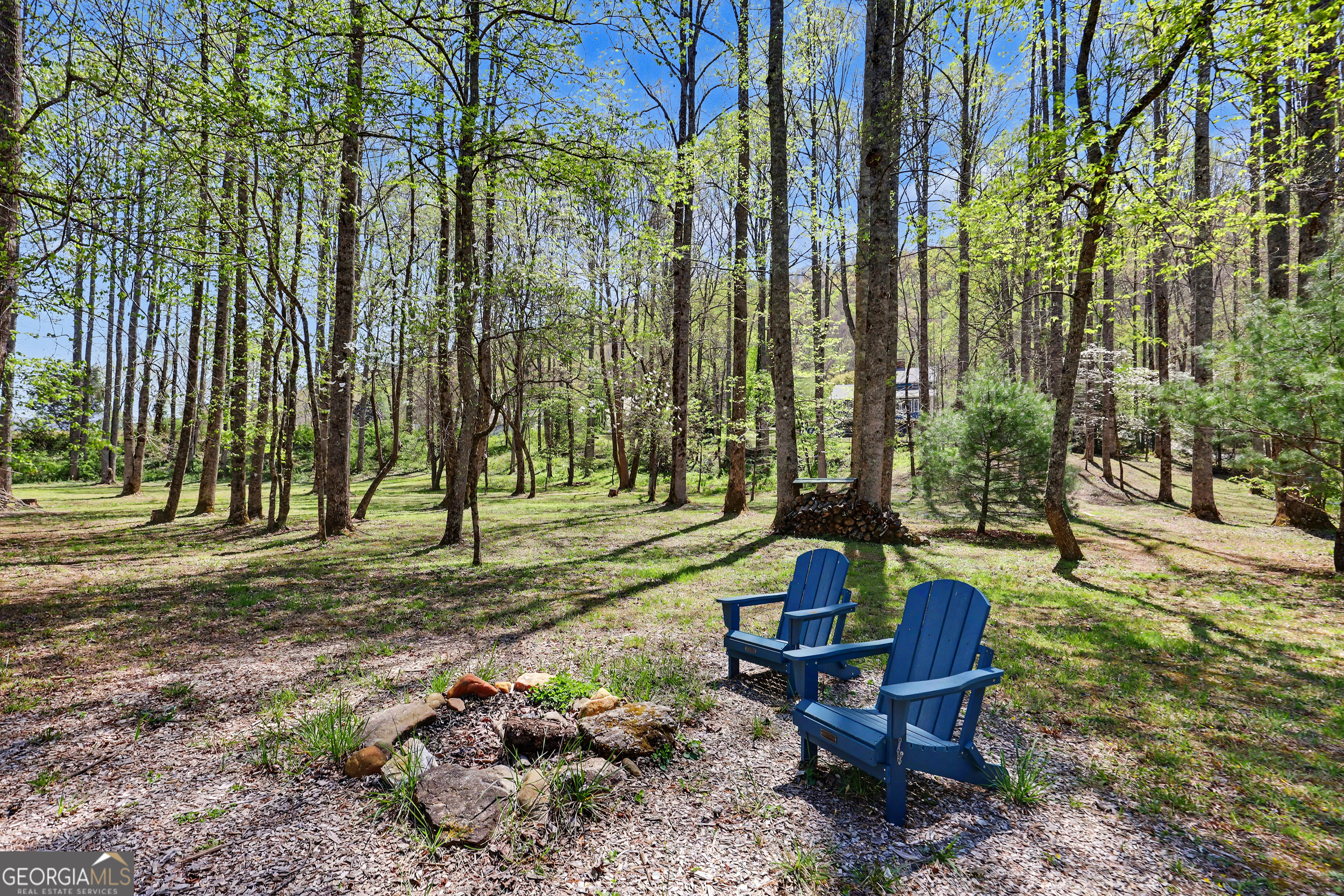 1067-o V Ov Justus Road Rabun Gap, GA 30568 - Photo 66 of 73 a backyard of a house with table and chairs