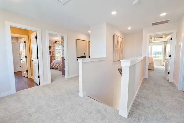 a spacious bedroom with a bed and a large window