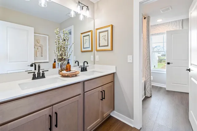 a bed room with a bed and a chandelier