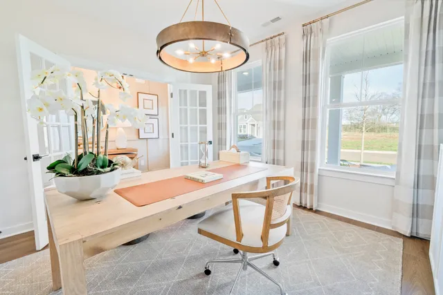 a room with a table and chairs