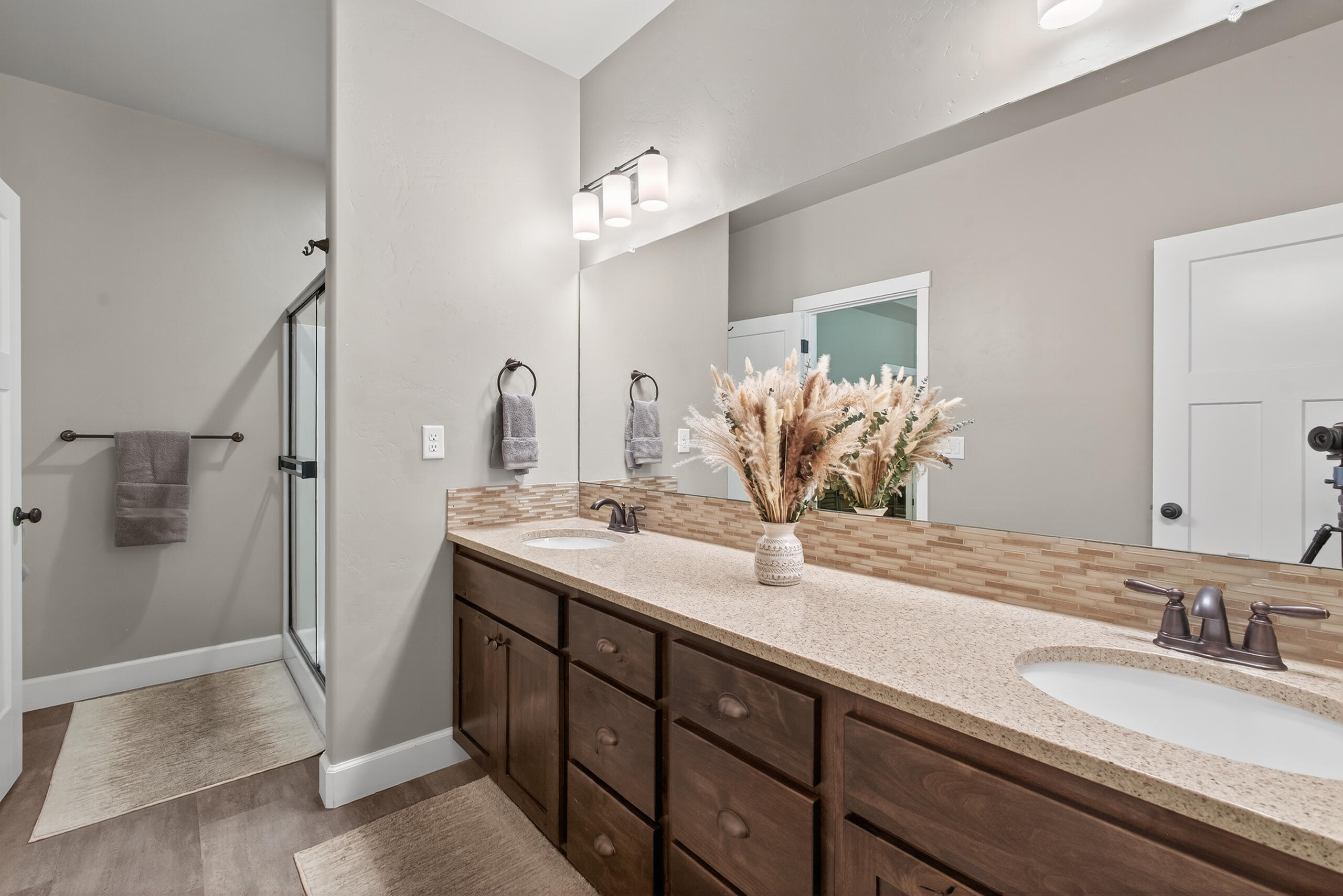 2793 Southwest 33rd Street Redmond, OR 97756 - Photo 21 of 44 a bathroom with a granite countertop sink and a mirror