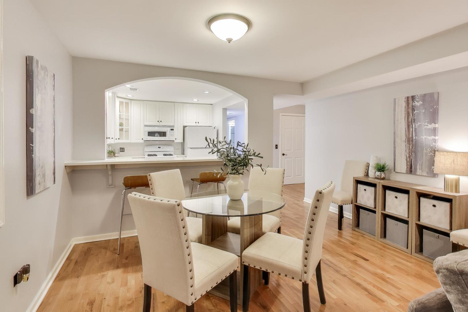 4212 North Ashland Avenue, Unit GS Chicago, IL 60613 - Photo 2 of 16 a dining room with furniture and window