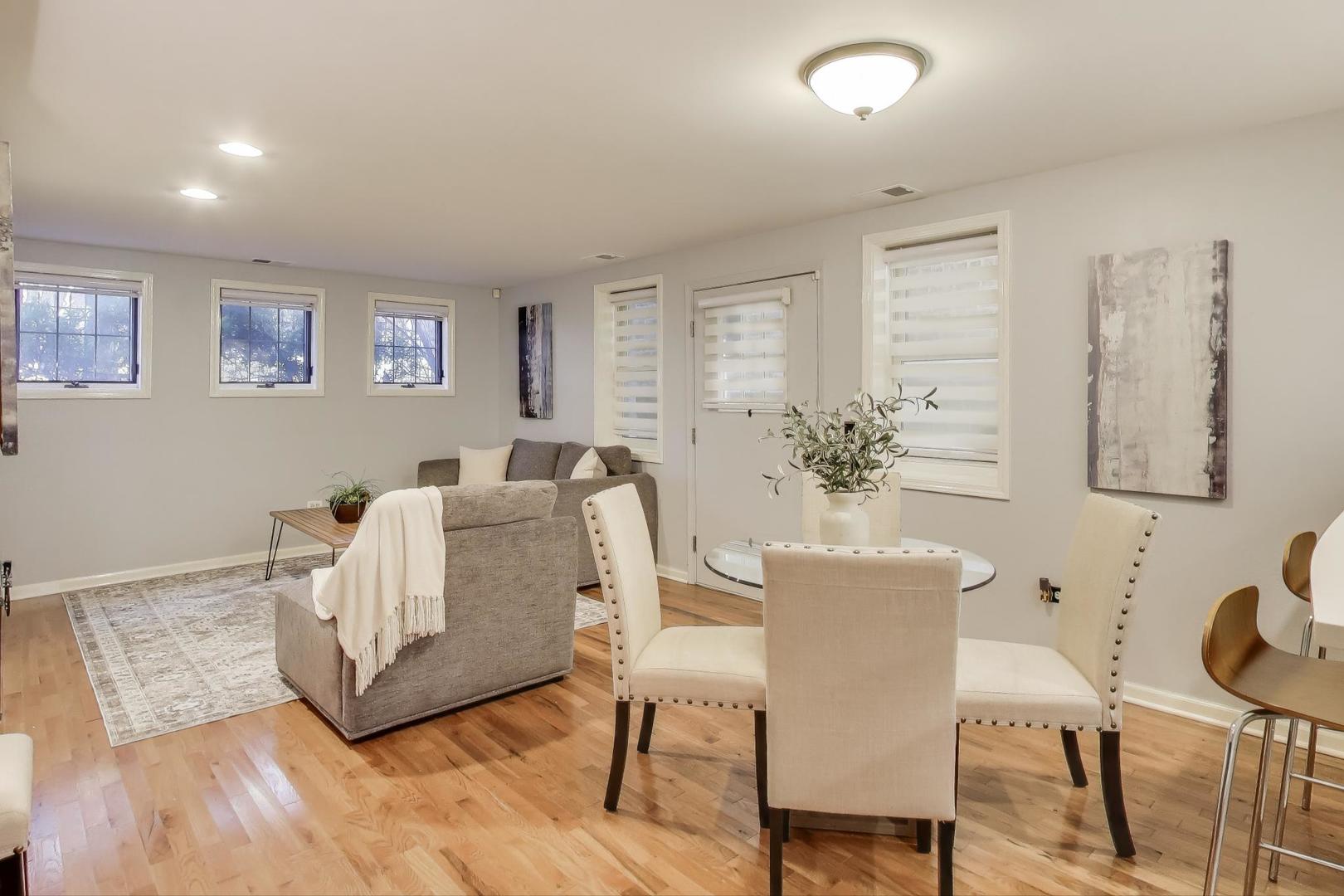 4212 North Ashland Avenue, Unit GS Chicago, IL 60613 - Photo 3 of 16 a living room with furniture and a wooden floor