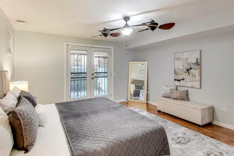 a bedroom with a large bed and a couch