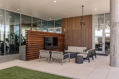 a view of a dining room with furniture and window