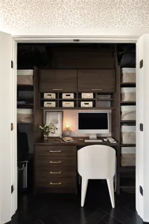 a room with a chair and a stove