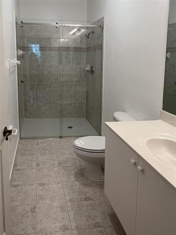 2904 Crestwood Terrace, Unit 4104 Margate, FL 33063 - Photo 13 of 21 a bathroom with a sink a toilet and shower