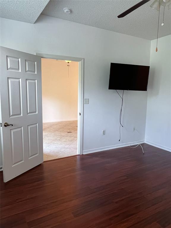 2904 Crestwood Terrace, Unit 4104 Margate, FL 33063 - Photo 14 of 21 a view of an empty room with wooden floor and a window