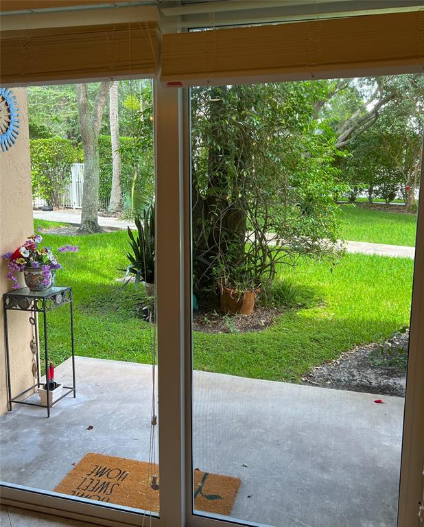 2904 Crestwood Terrace, Unit 4104 Margate, FL 33063 - Photo 15 of 21 a view of a porch and garden