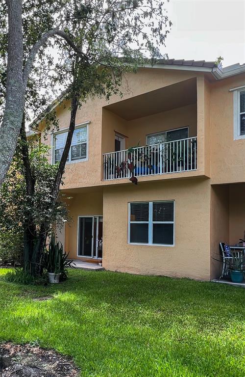 2904 Crestwood Terrace, Unit 4104 Margate, FL 33063 - Photo 18 of 21 a front view of a house with a garden
