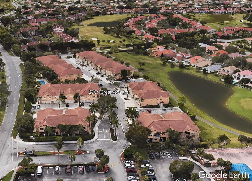 2904 Crestwood Terrace, Unit 4104 Margate, FL 33063 - Photo 21 of 21 an aerial view of residential houses with outdoor space