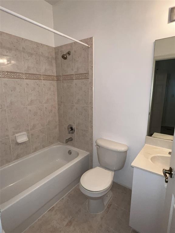 2904 Crestwood Terrace, Unit 4104 Margate, FL 33063 - Photo 7 of 21 a bath room with a toilet a sink and a bath tub