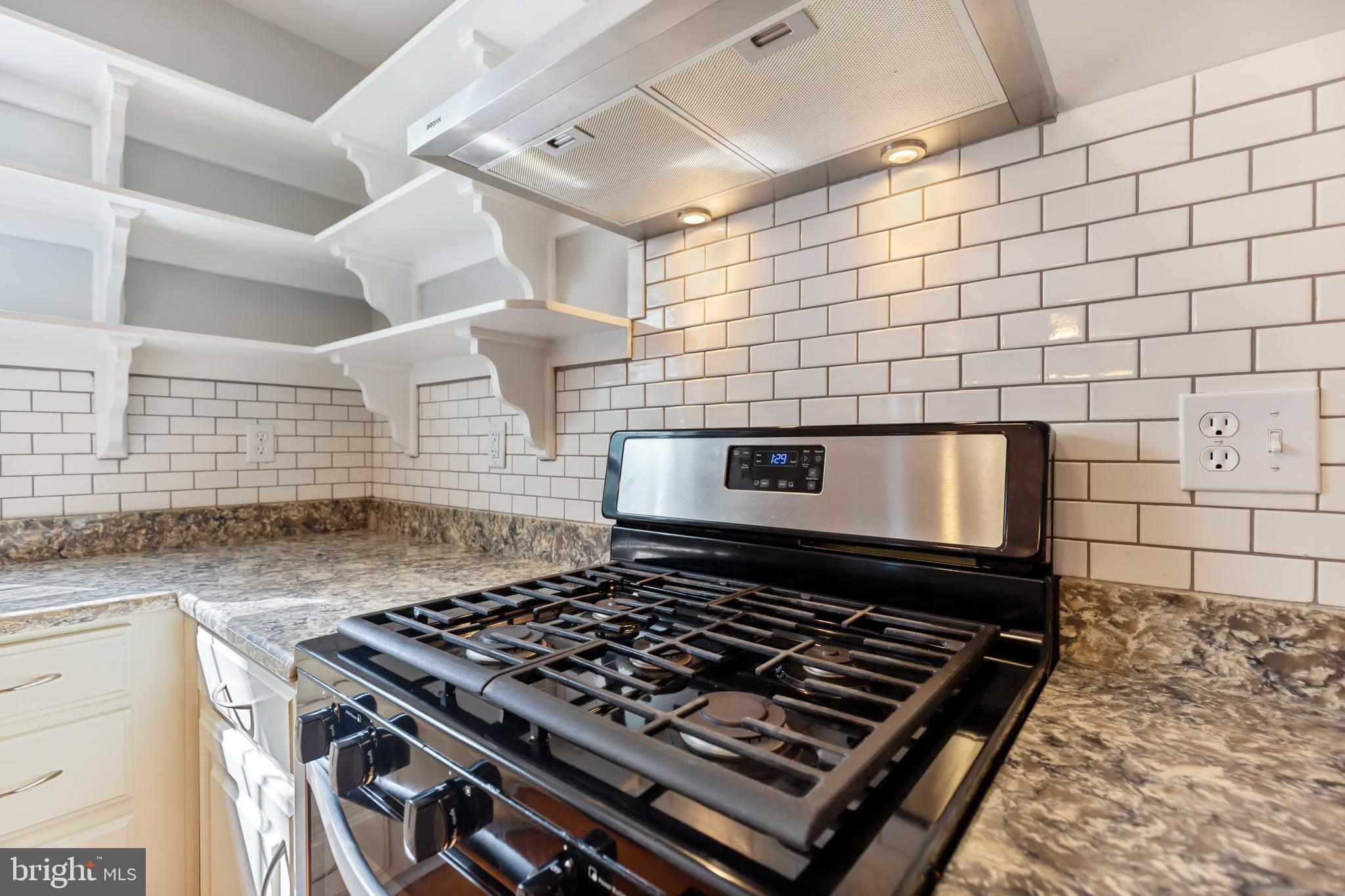 8140 Simpson Farm Road Owings, MD 20736 - Photo 14 of 31 Gas range with stainless hood
