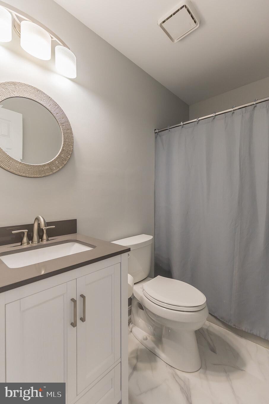 8140 Simpson Farm Road Owings, MD 20736 - Photo 26 of 31 Upstairs hall BA - new reno includes quartz & LVT