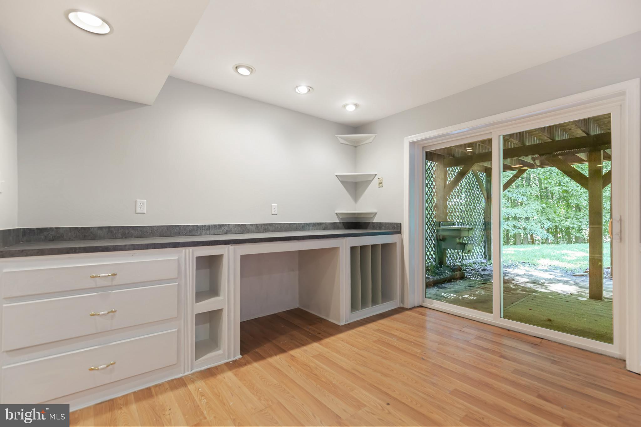 8140 Simpson Farm Road Owings, MD 20736 - Photo 27 of 31 BSMT FR w/incredible built-ins & slider to patio